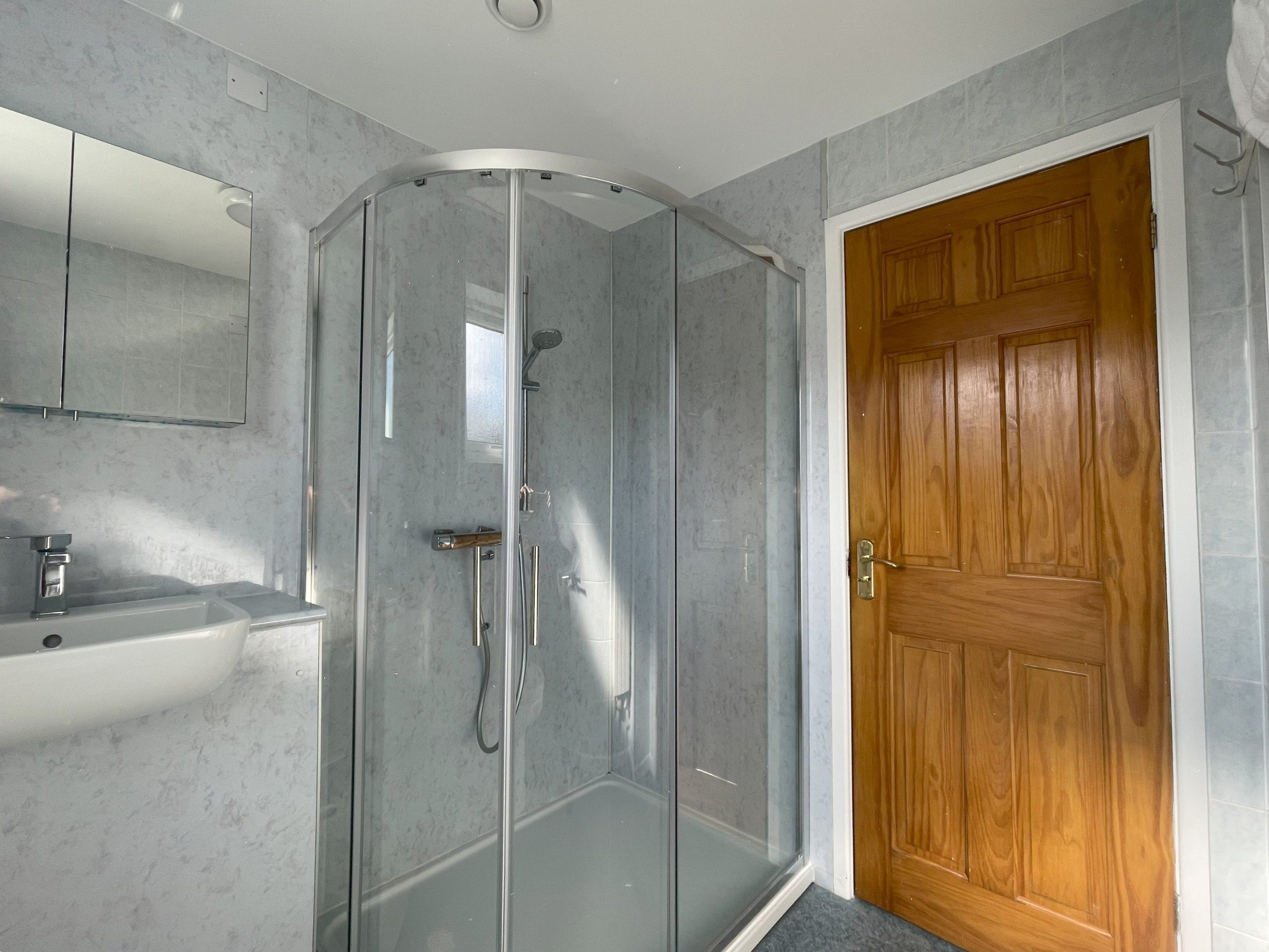 There is a large shower in the family bathroom