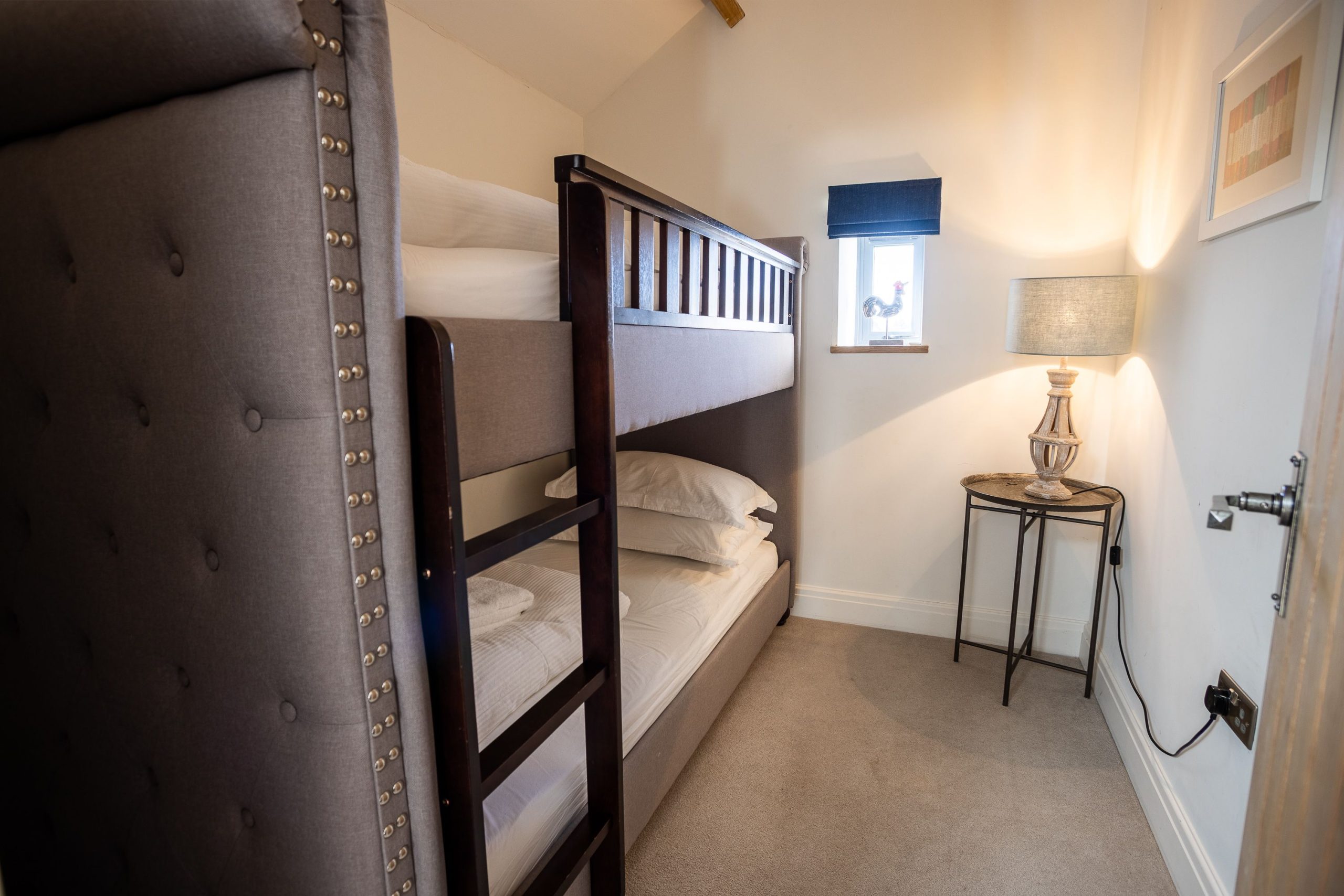 The final bedroom has bunk beds, providing the perfect hangout for kids!