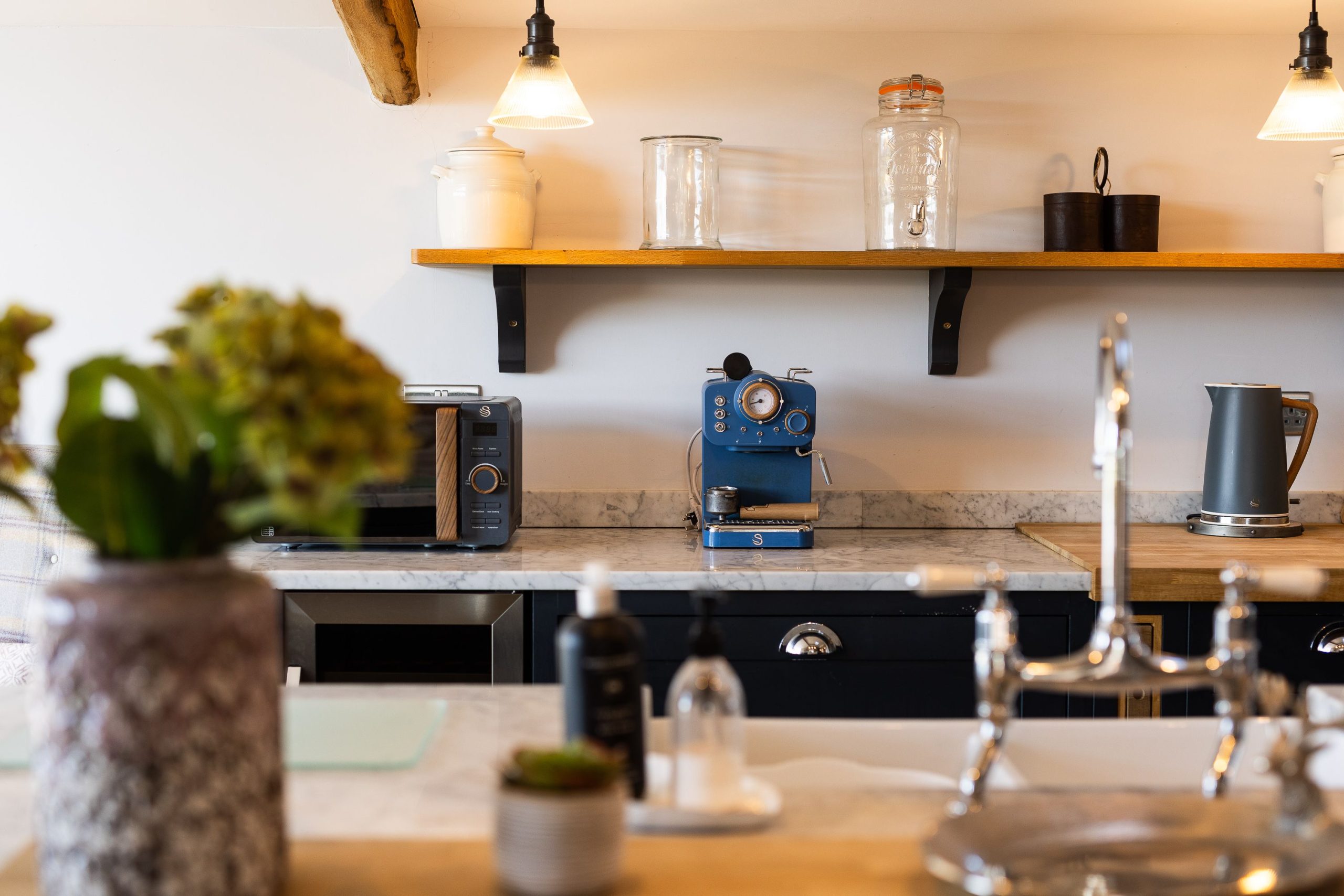 large sociable kitchen diner with island unit and bar stools