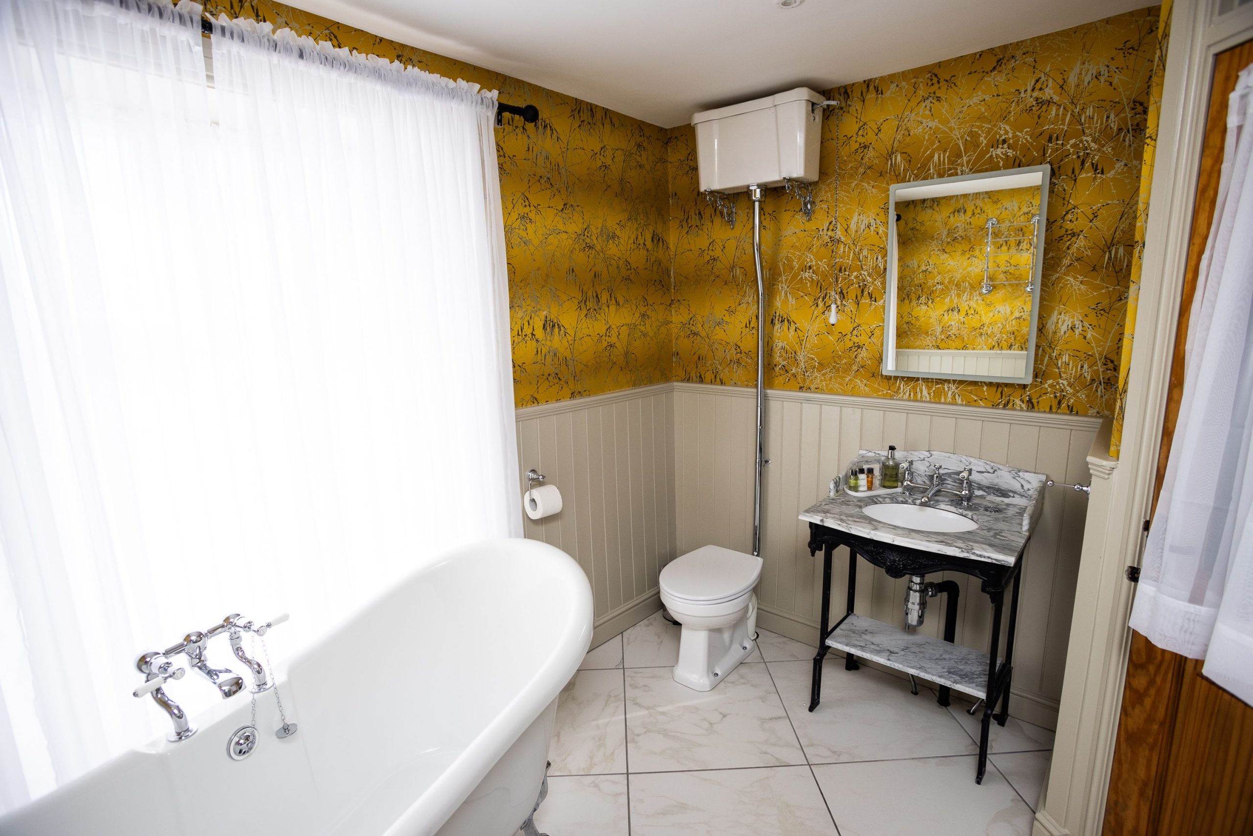 Guests can rest tired feet and enjoy a soak in the stunning rolltop freestanding bath after a day of exploring