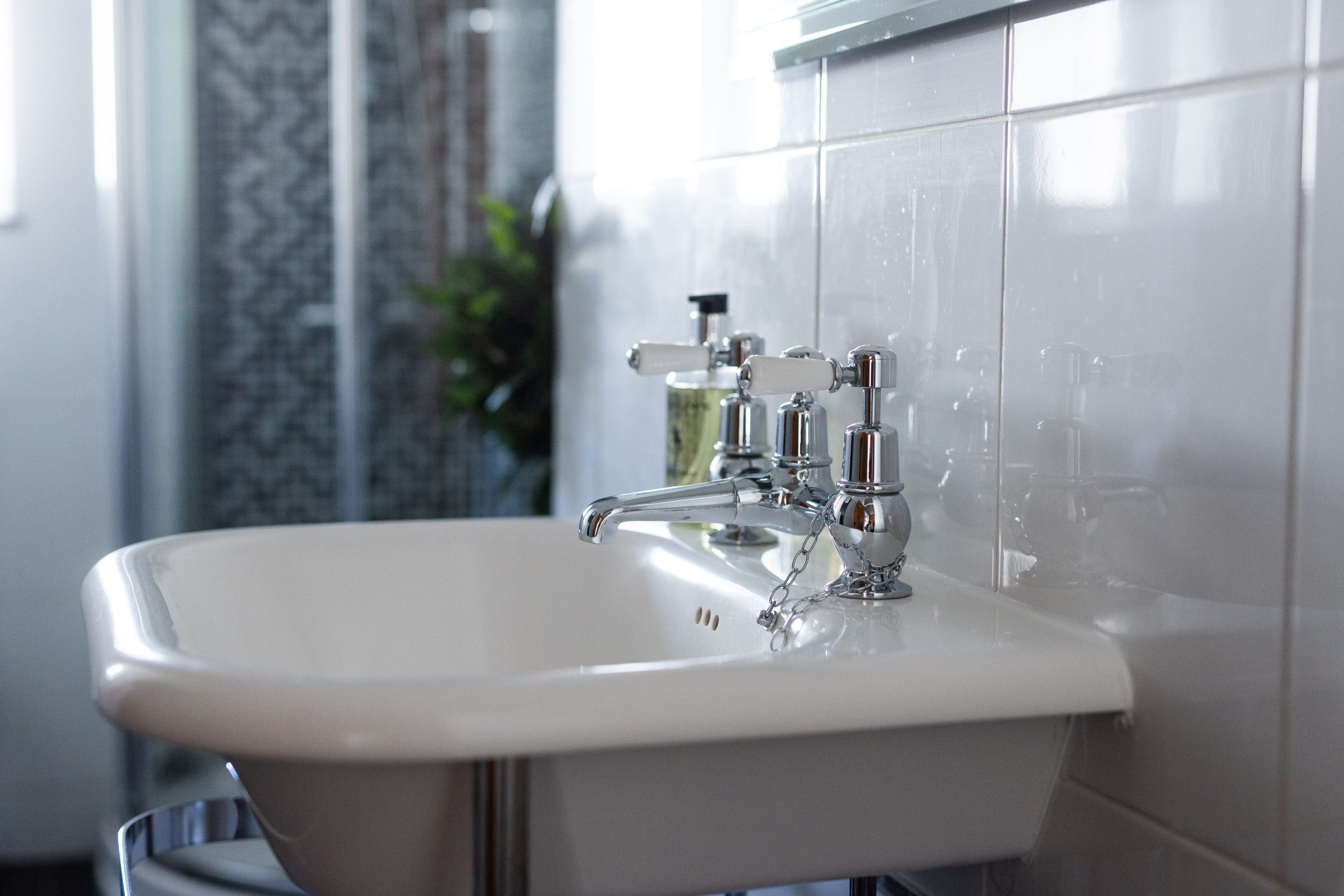 smart shower room with shower cubicle, basin and WC.