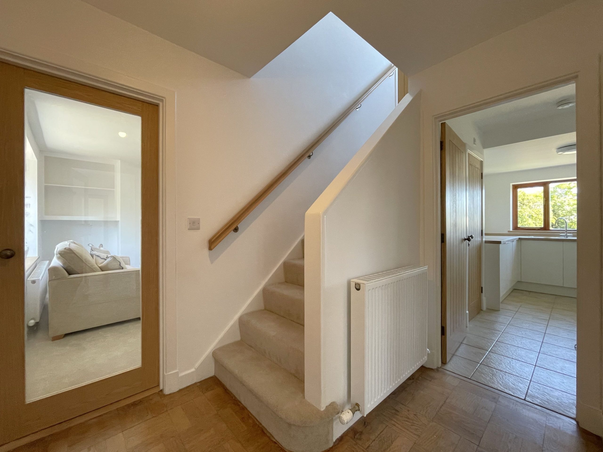 The hallway is bright and welcoming as you enter the property