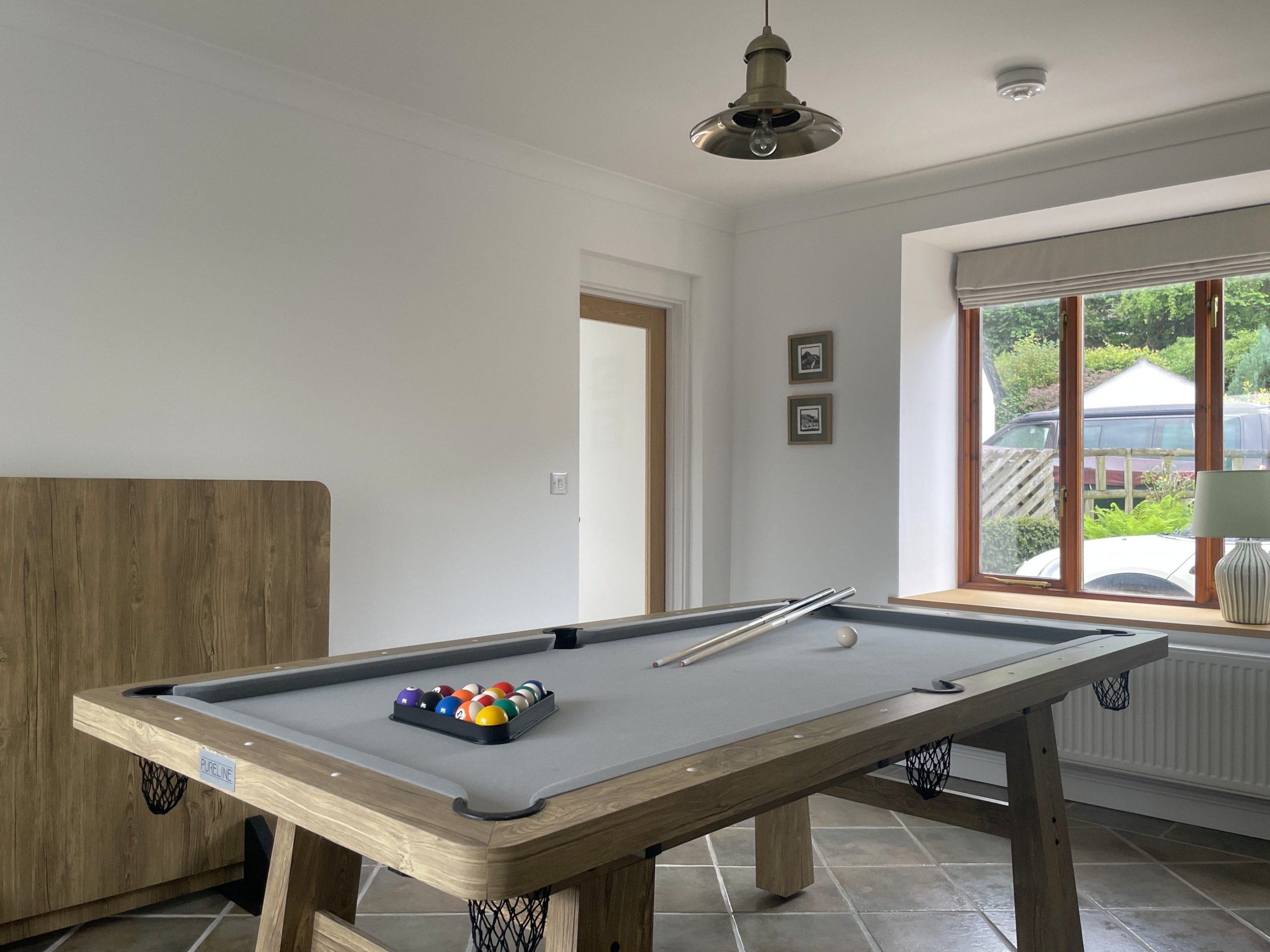 Games room where the family can gather for lots of fun, including a game of pool!