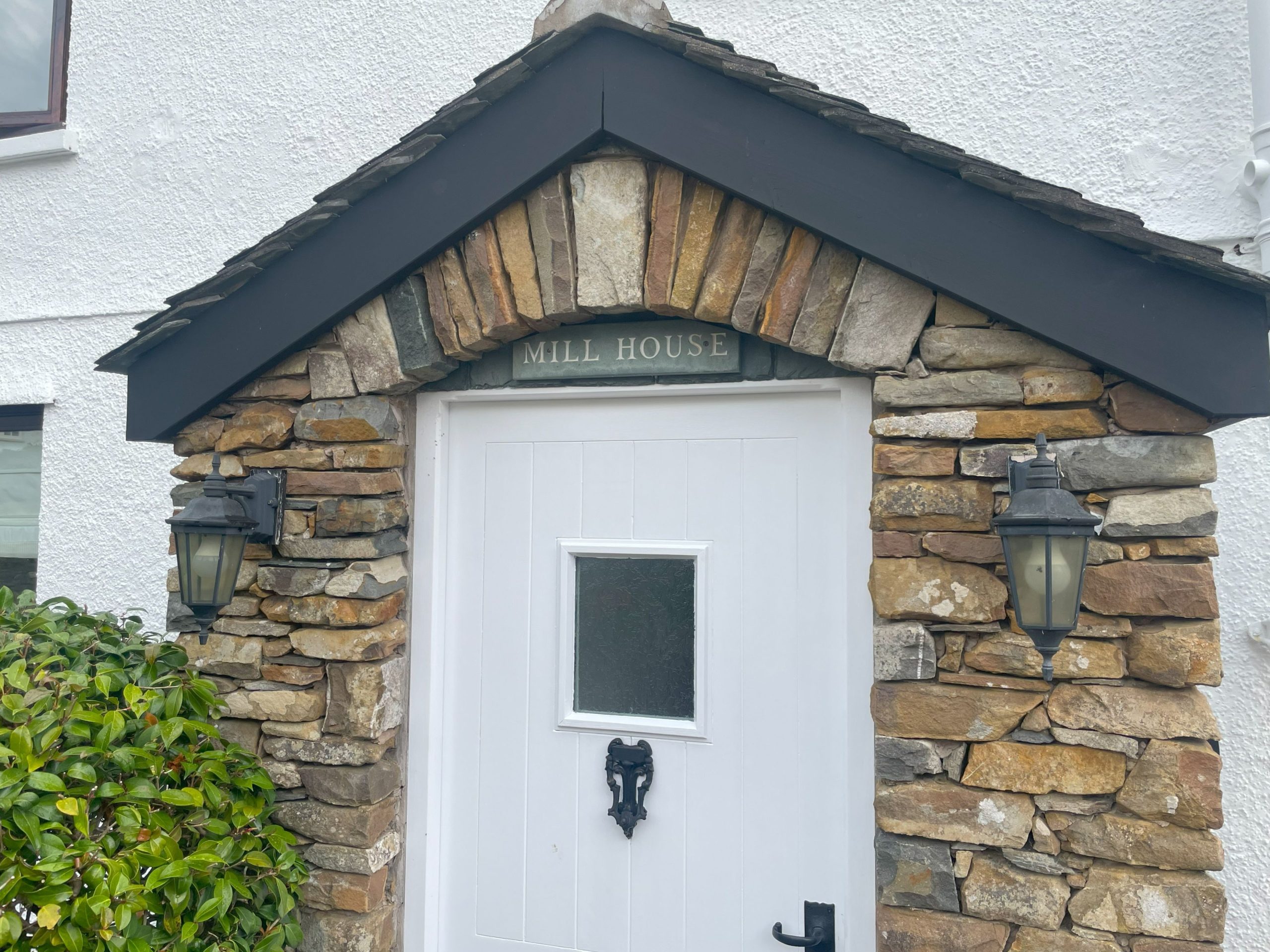 The stone porch leading in to the front of Mill House