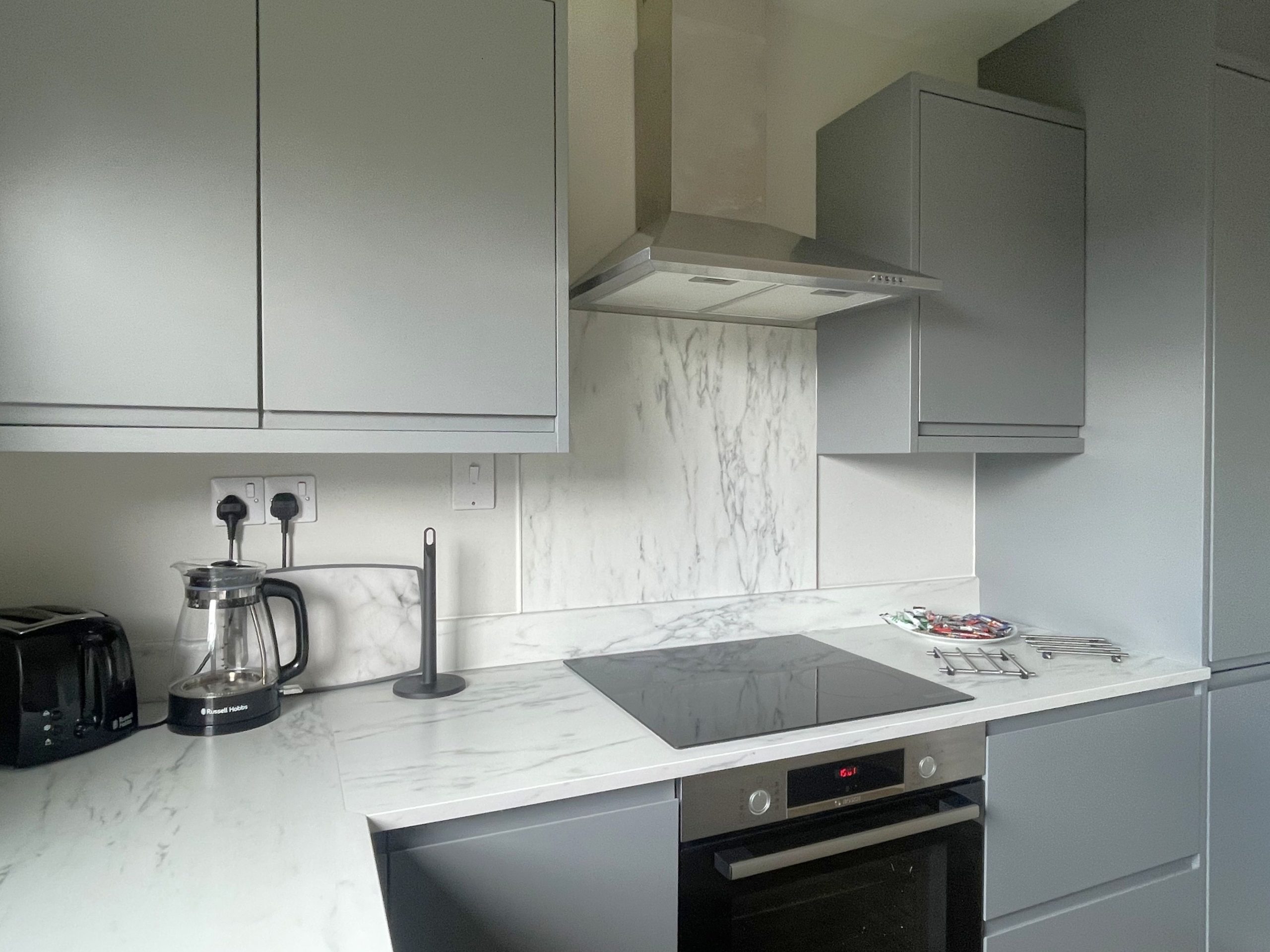 The kitchen is fitted with modern furnishings and facilities, perfect for self-catering.