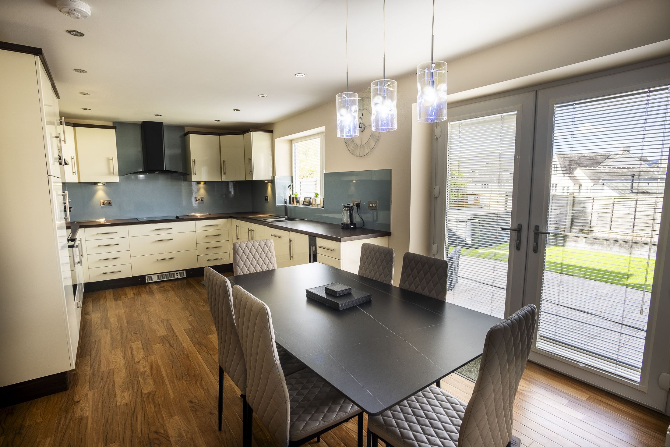 The open-plan kitchen and dining space is perfect for entertaining, or spending time together at mealtimes. 