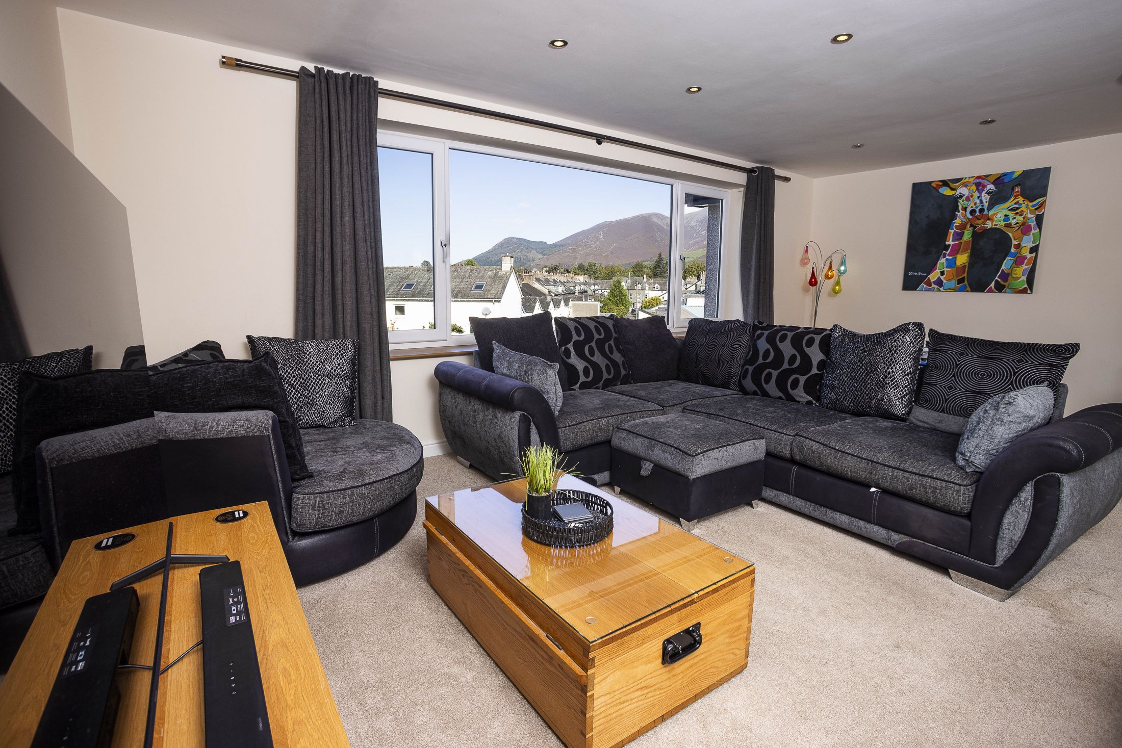 The living space is well-furnished with comfortable couches and enough space for everyone.