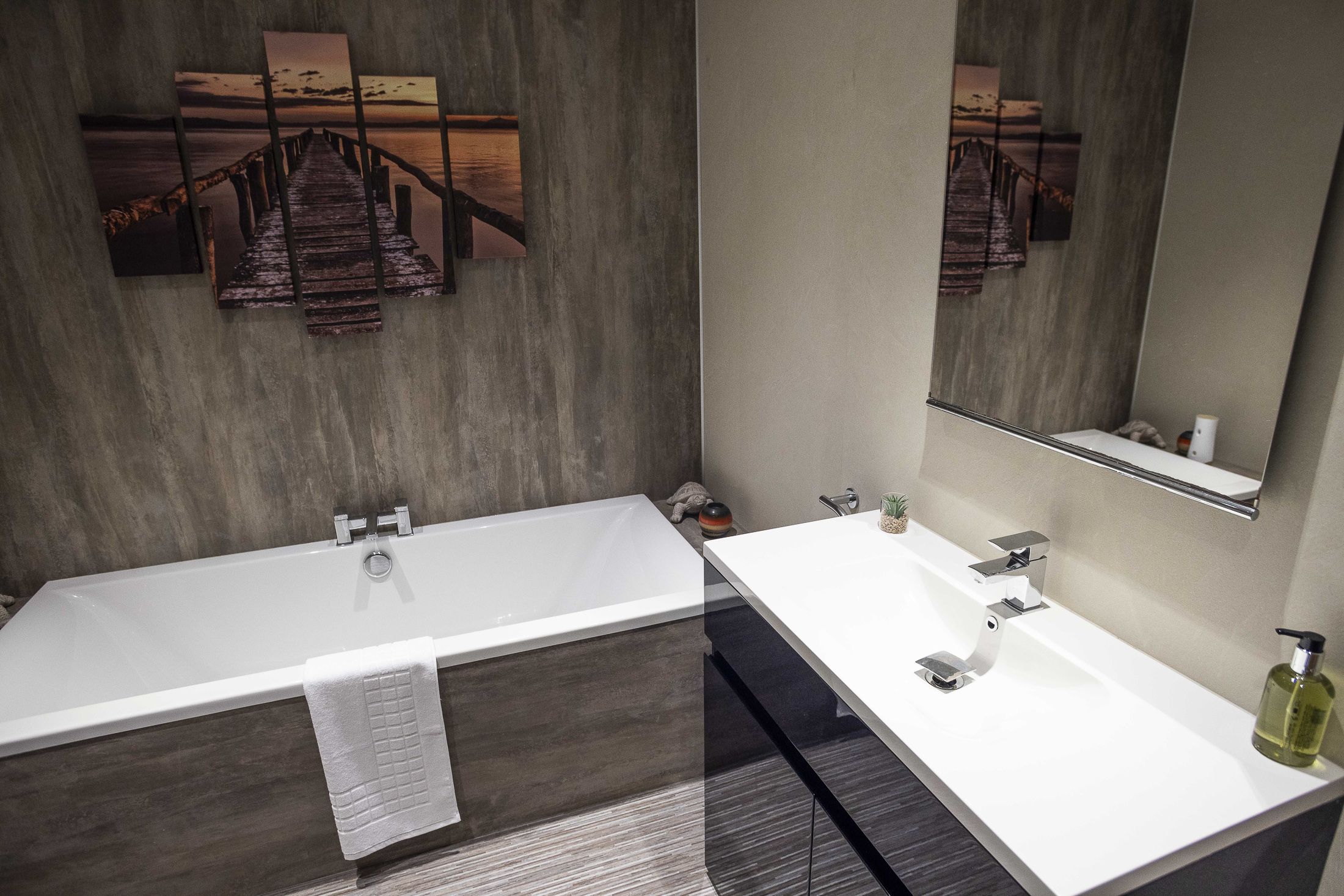 Spacious family bathroom with separate bath and shower, WC, and sink