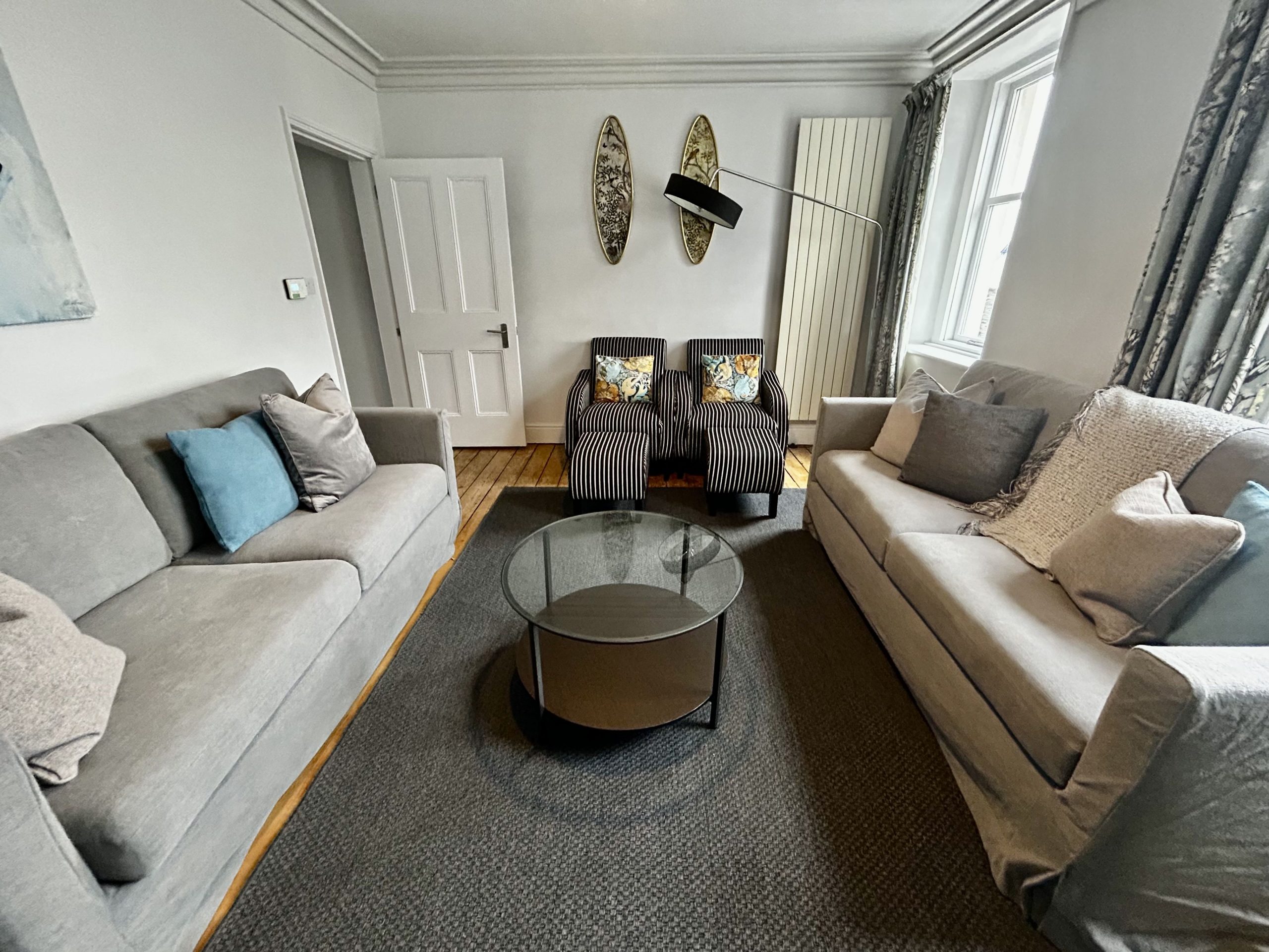 With NEW sofas, unwind in the spacious living room.