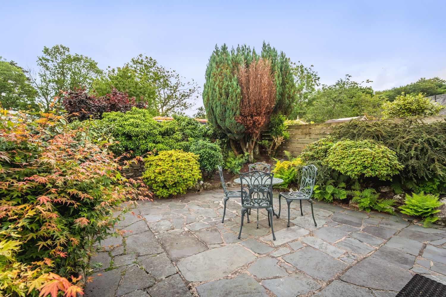 To the rear of the property is a beautifully maintained enclosed garden