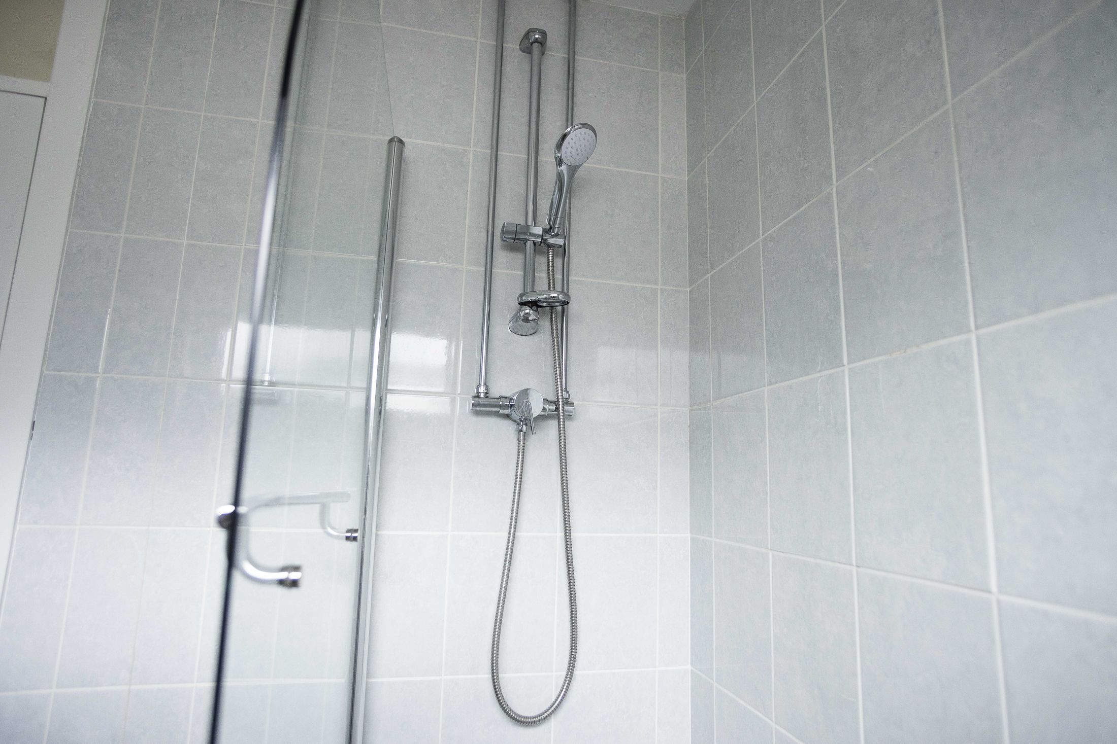 here is also a family bathroom with shower/bath, WC and sink