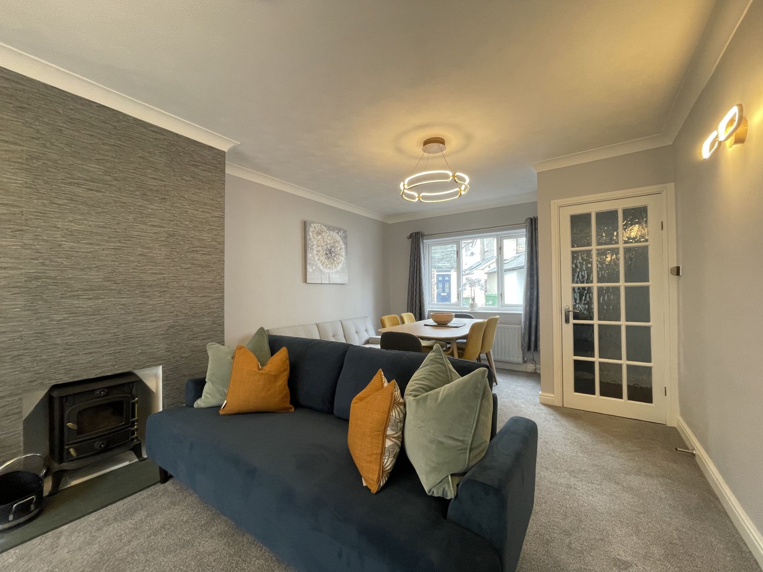  Relax and make yourself comfortable on the three-seater sofa while enjoying the warming cosy log burner.