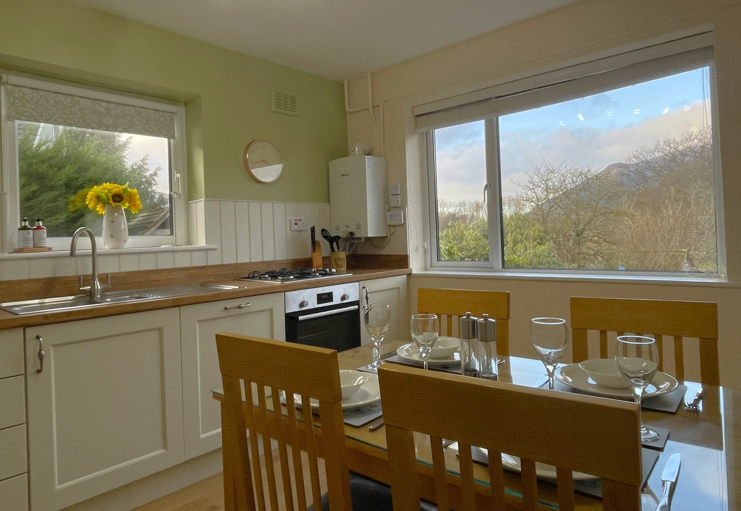 The well equipped kitchen comes complete with electric fan oven, gas hob, dishwasher, fridge, freezer, microwave, table and four chairs.