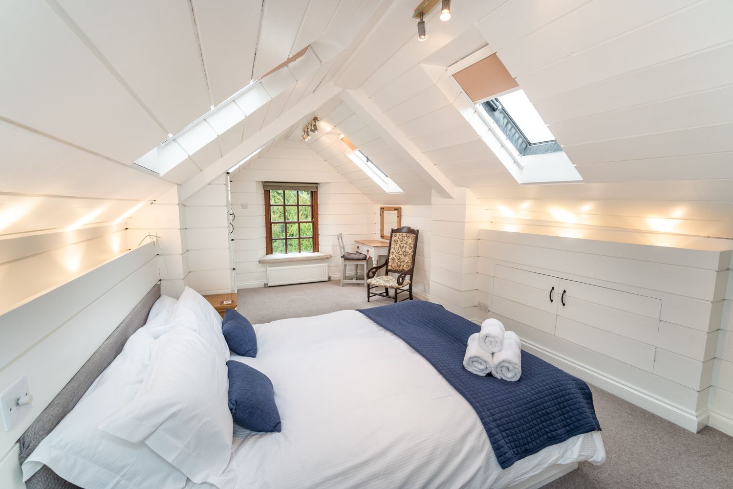 The master suite has a king sized bed and ensuite shower room