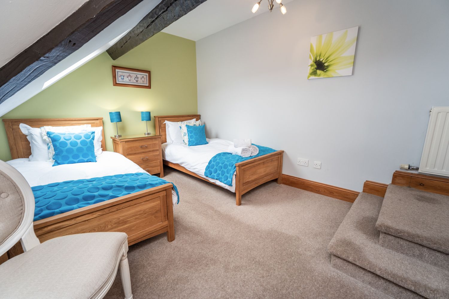 The room features the gorgeous beams found throughout the apartment 