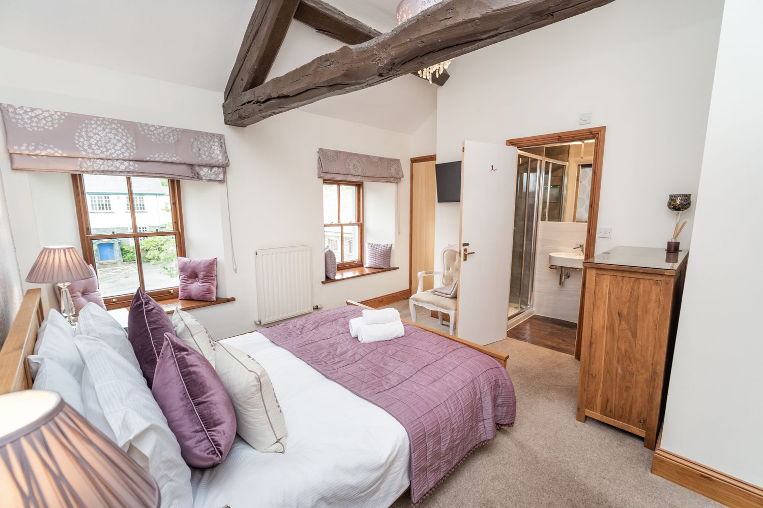 A spacious and airy master bedroom with king sized bed