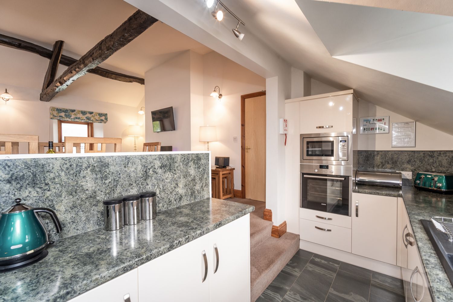 You can enjoy the view over the courtyard and garden from the kitchen area