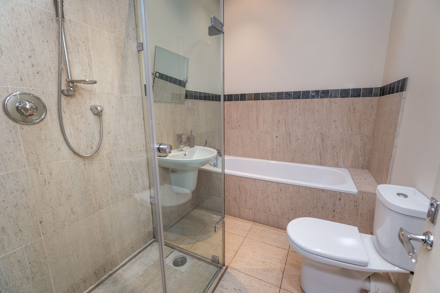 The first floor family bathroom with bath and separate walk in shower