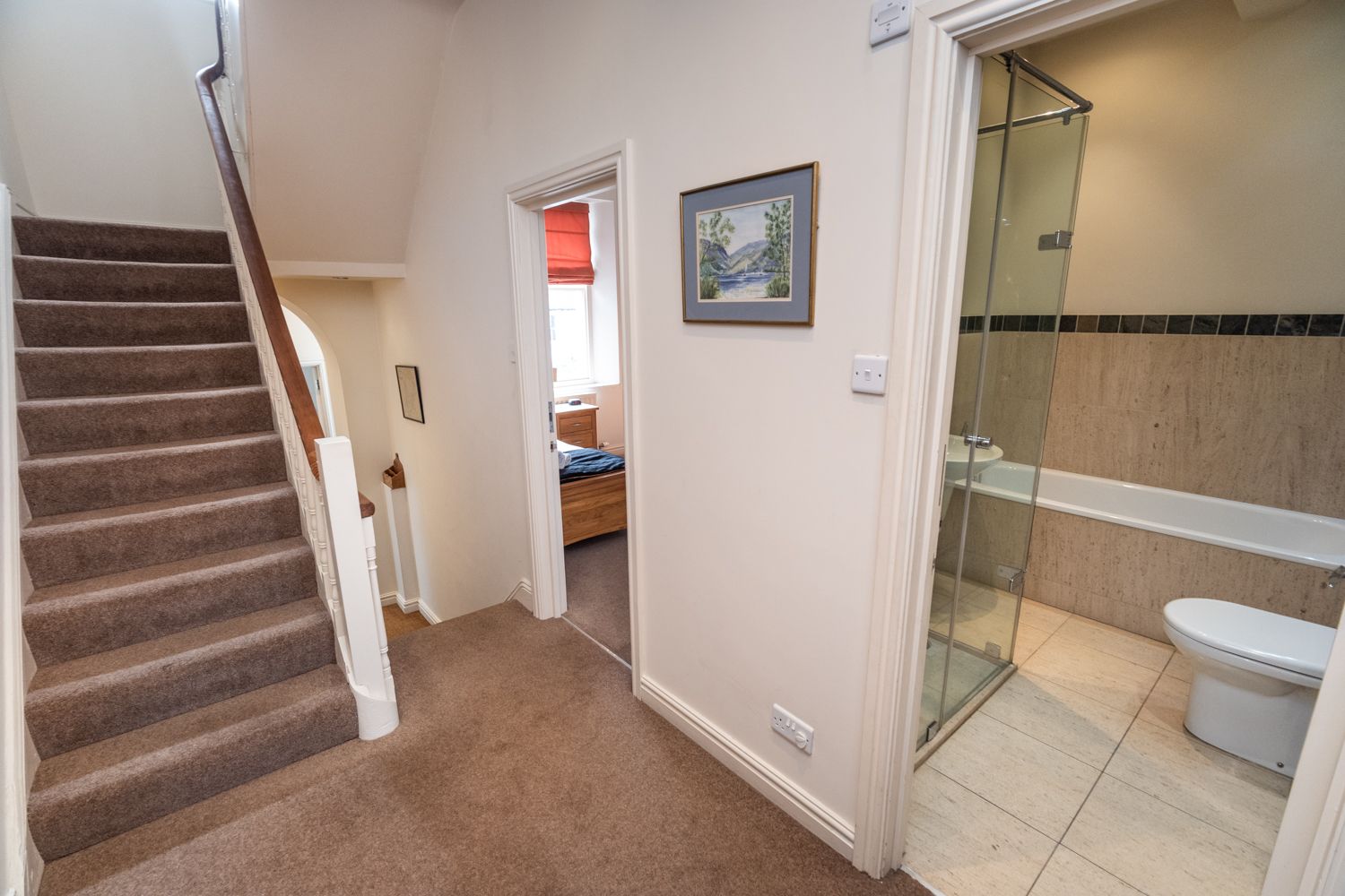 The single bedroom is at the rear of the property