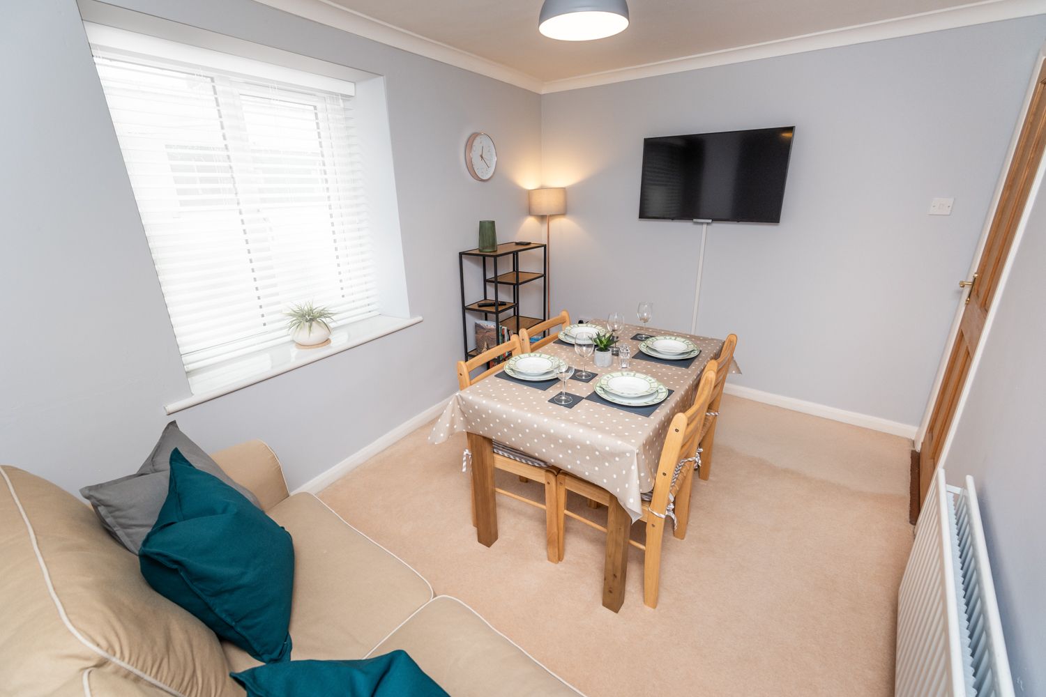 The property benefits from a separate dining area, which also features a wall mounted TV