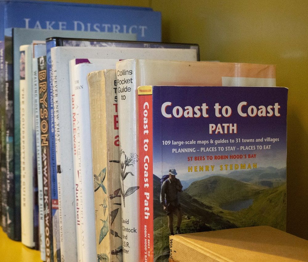 Reading material and walking inspiration can be found in the open plan living and kitchen area