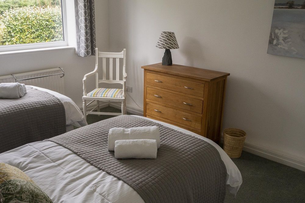 The second bedroom has lovely garden views