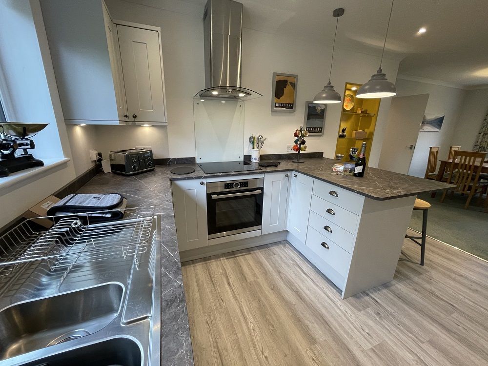 In the modern kitchen you will find induction hob, large fridge freezer and integrated dishwasher
