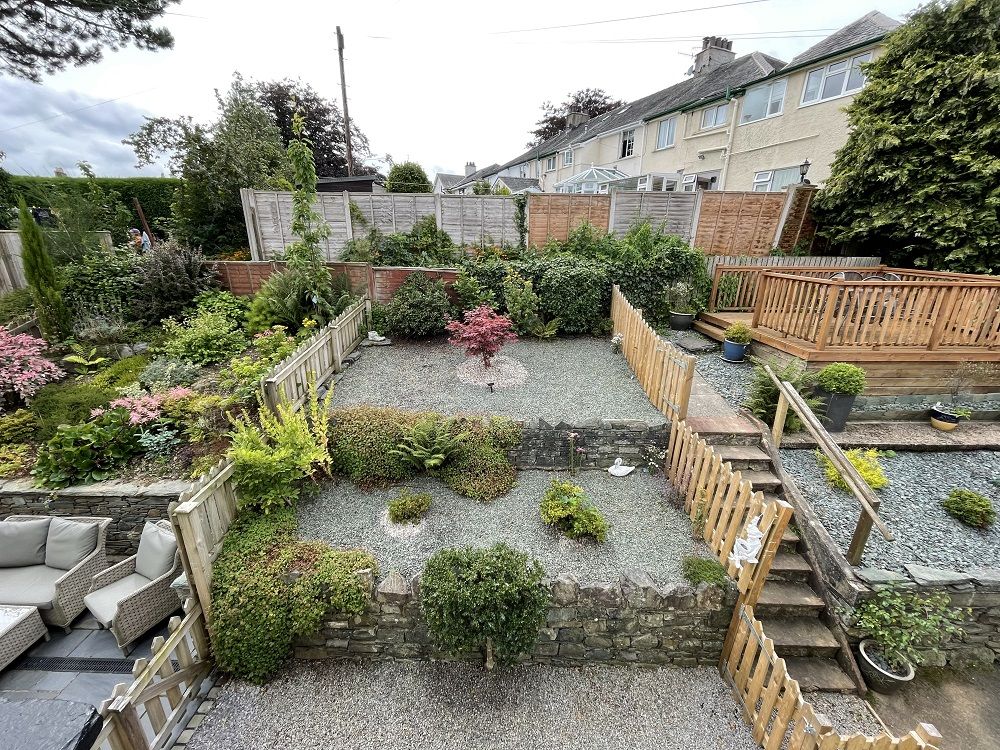 The pleasant front garden is a lovely place to relax in the Summer