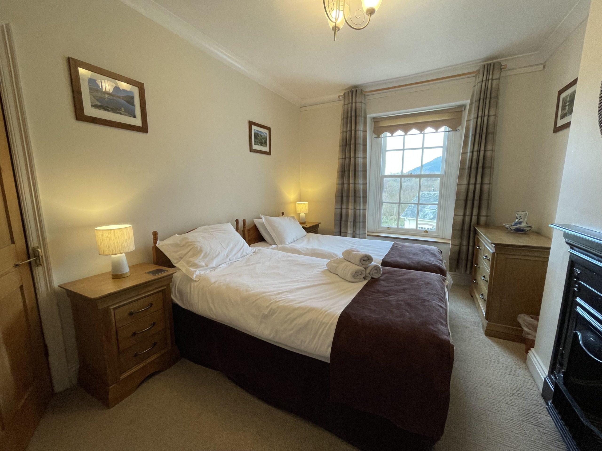 Both bedrooms feature decorative fireplaces