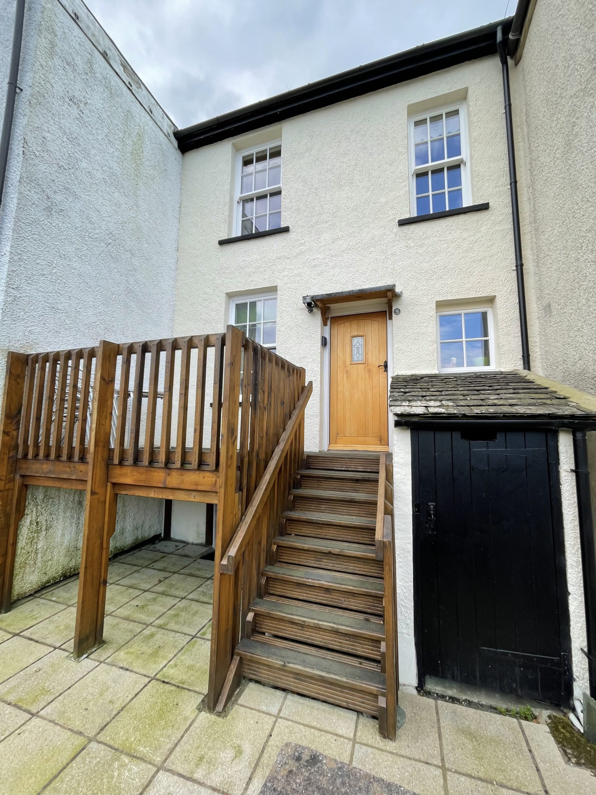 Tawny Cottage has a delightful elevated patio area leading to the back door of the property, which is used as the main entrance