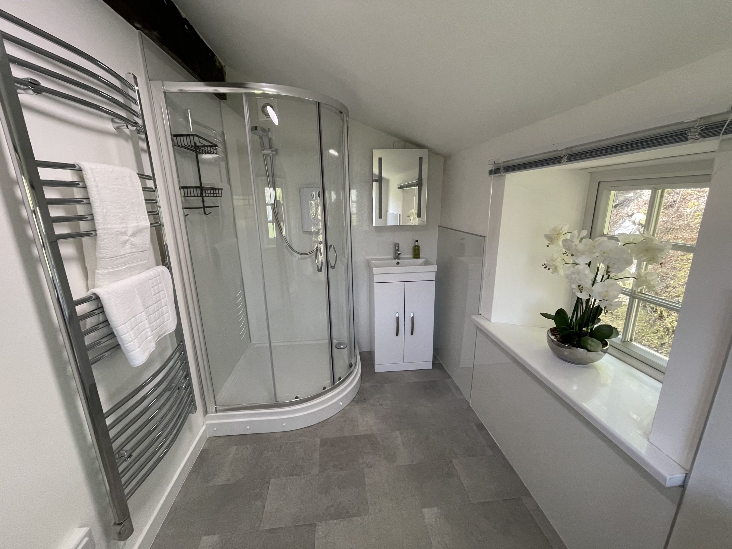 The master bedroom has an ensuite shower room