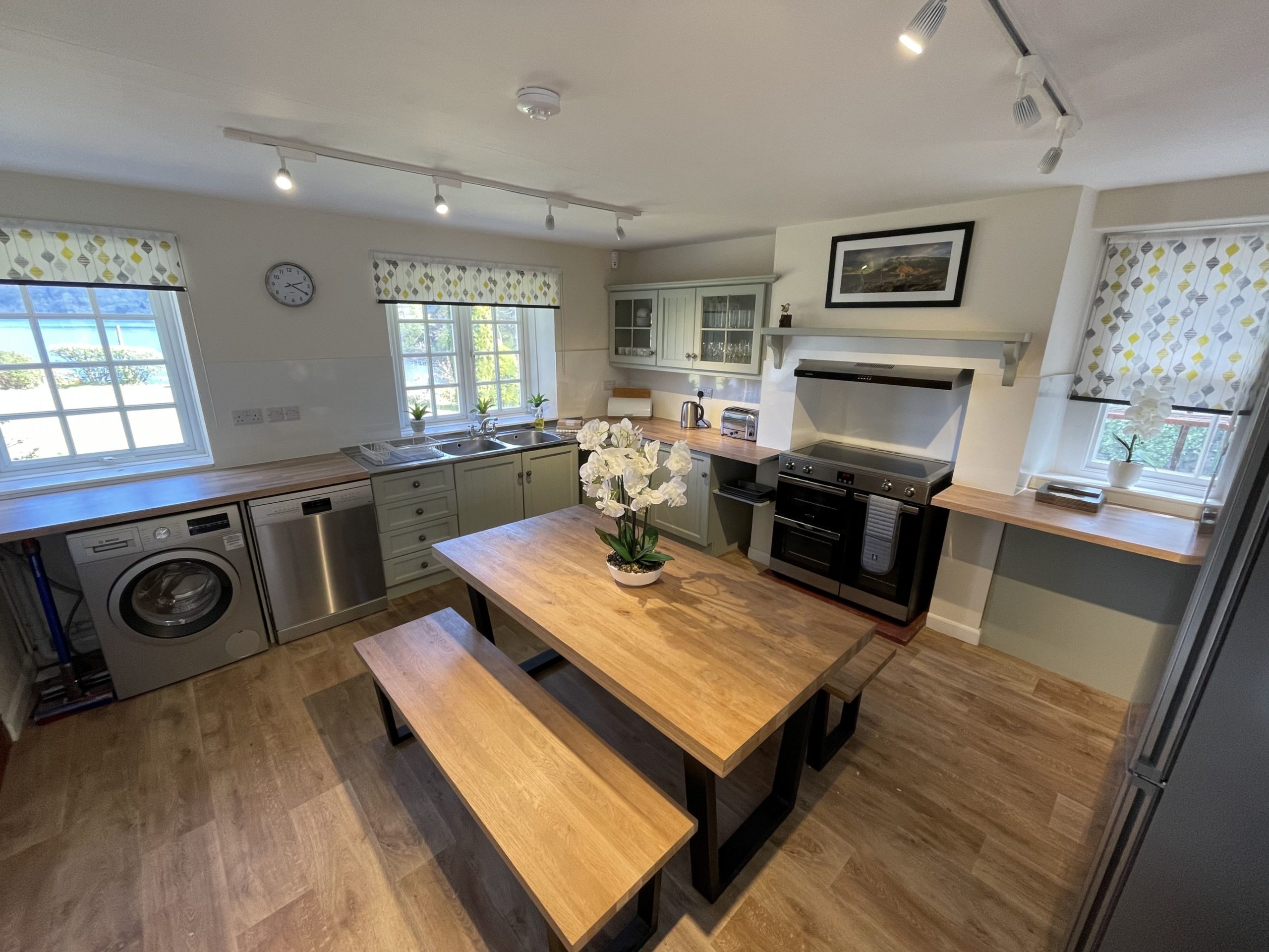 The rear entrance leads you into the farmhouse kitchen, which has lovely views across the lake
