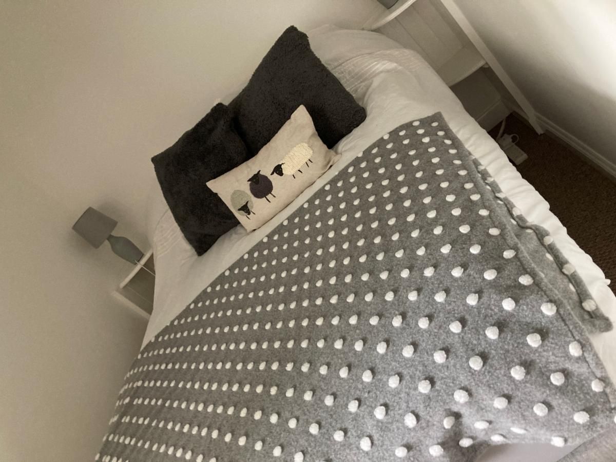 The second bedroom has a double bed, bedside tables and a wardrobe