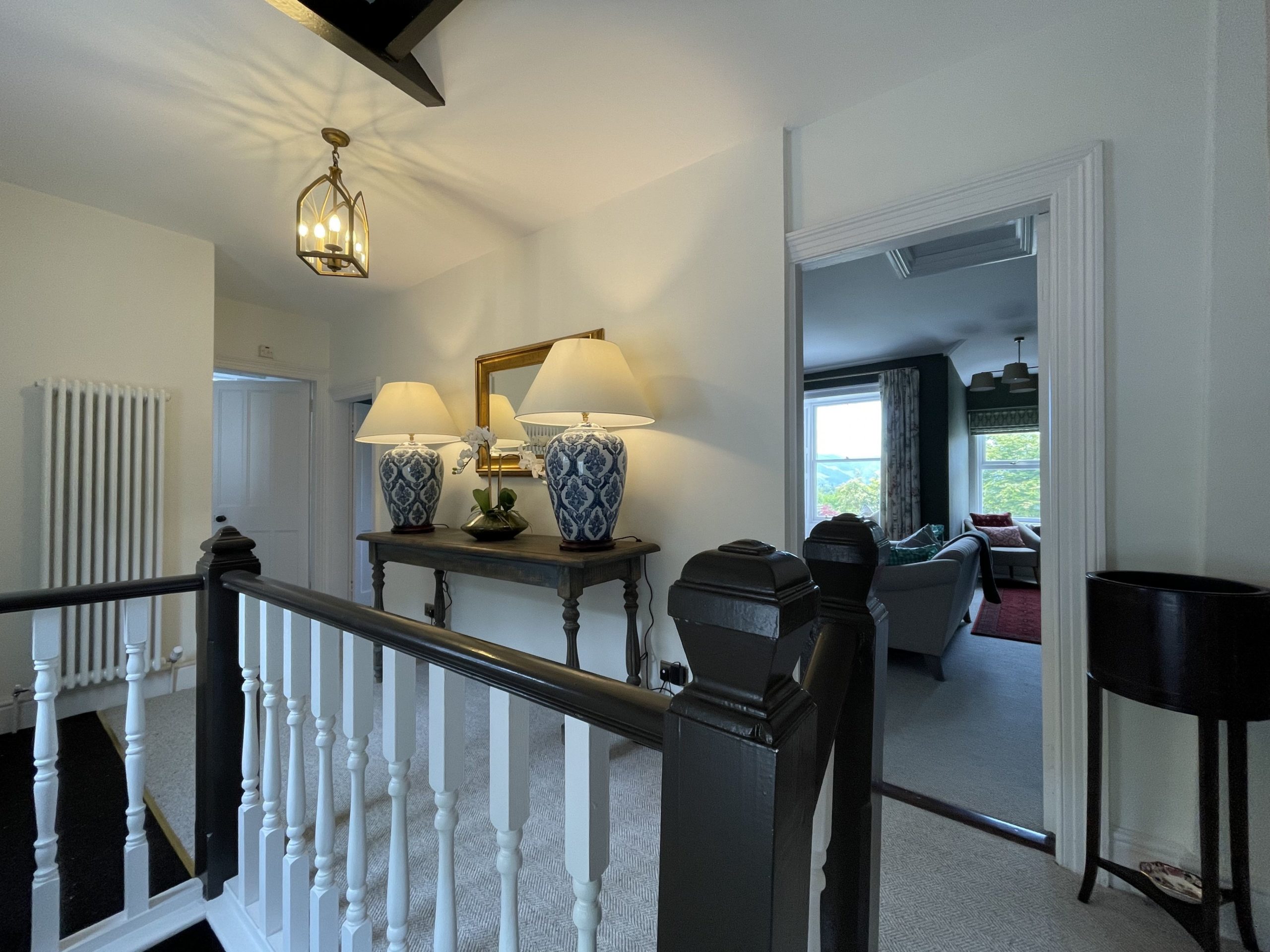 The entrance leads into an impressive hallway on the upper floor of the property
