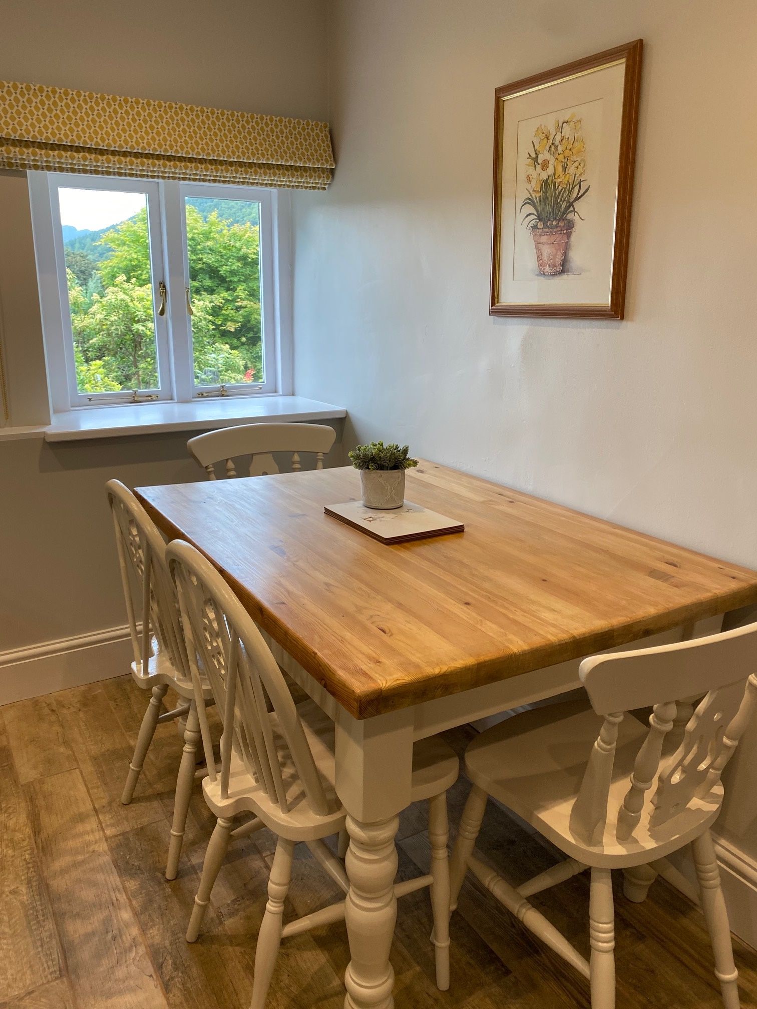 The dining table comfortably seats 4 people