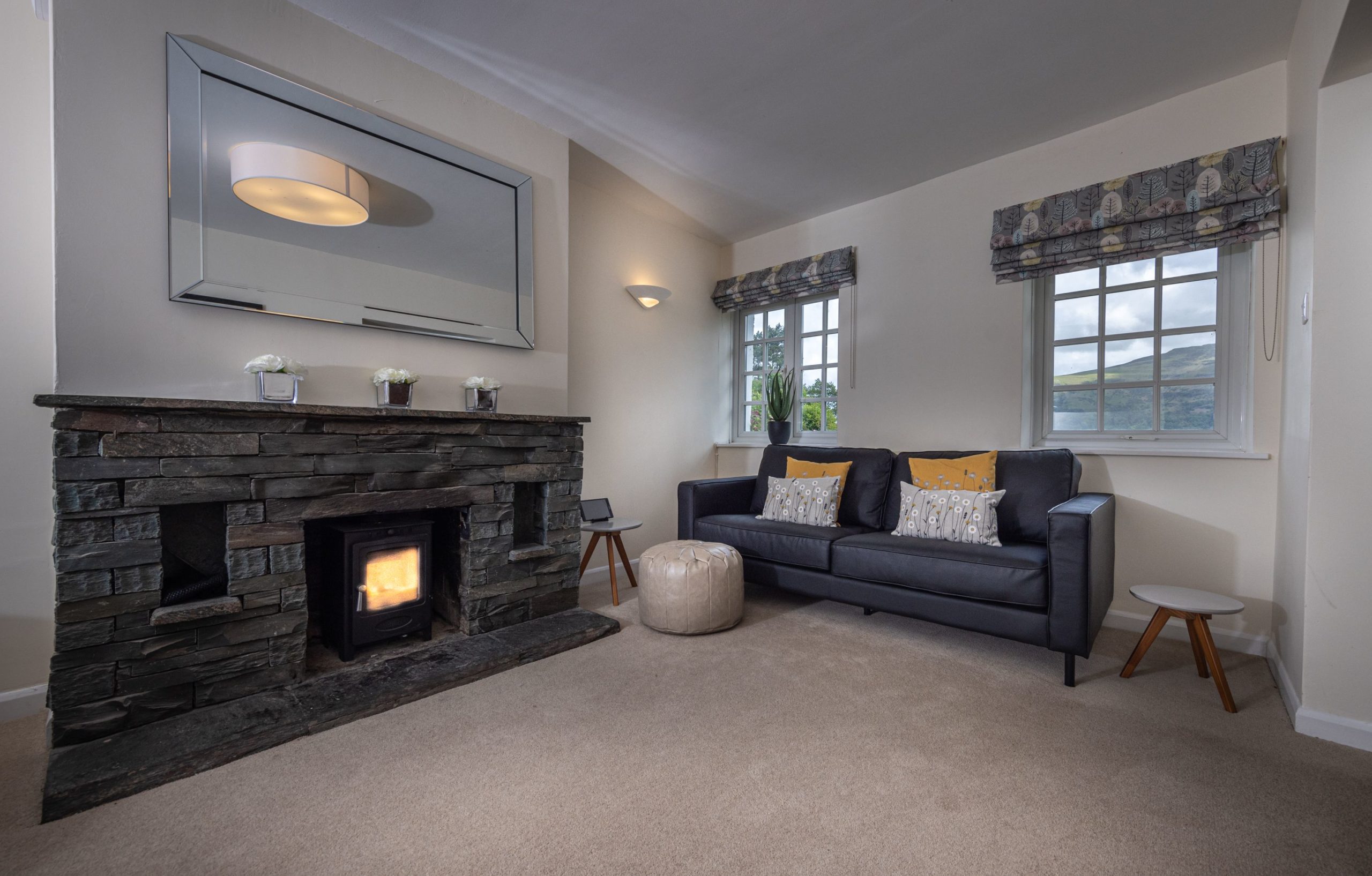 The log burning stove has a lovely slate surround