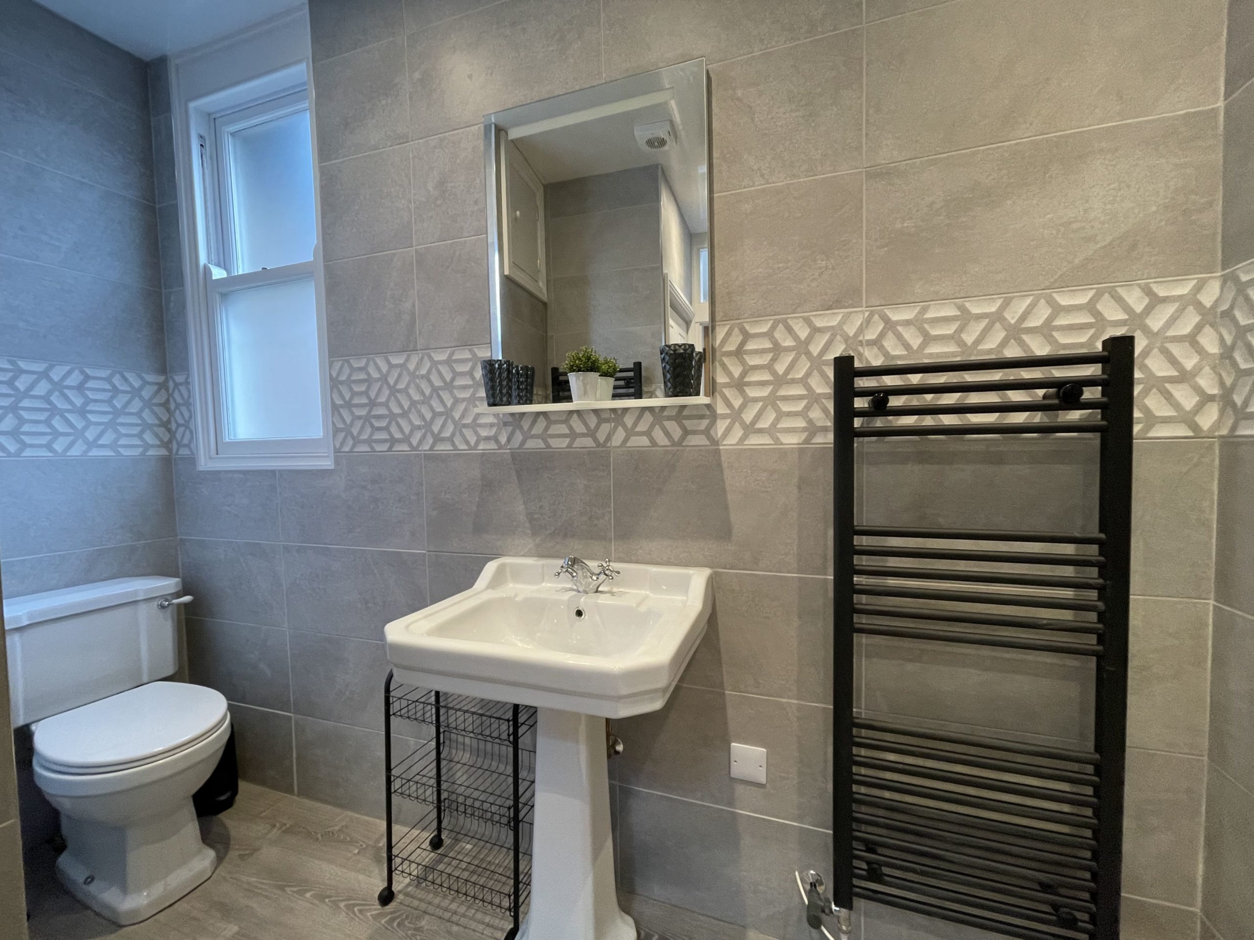 The bathroom also consists of a heated towel rail and light up mirror