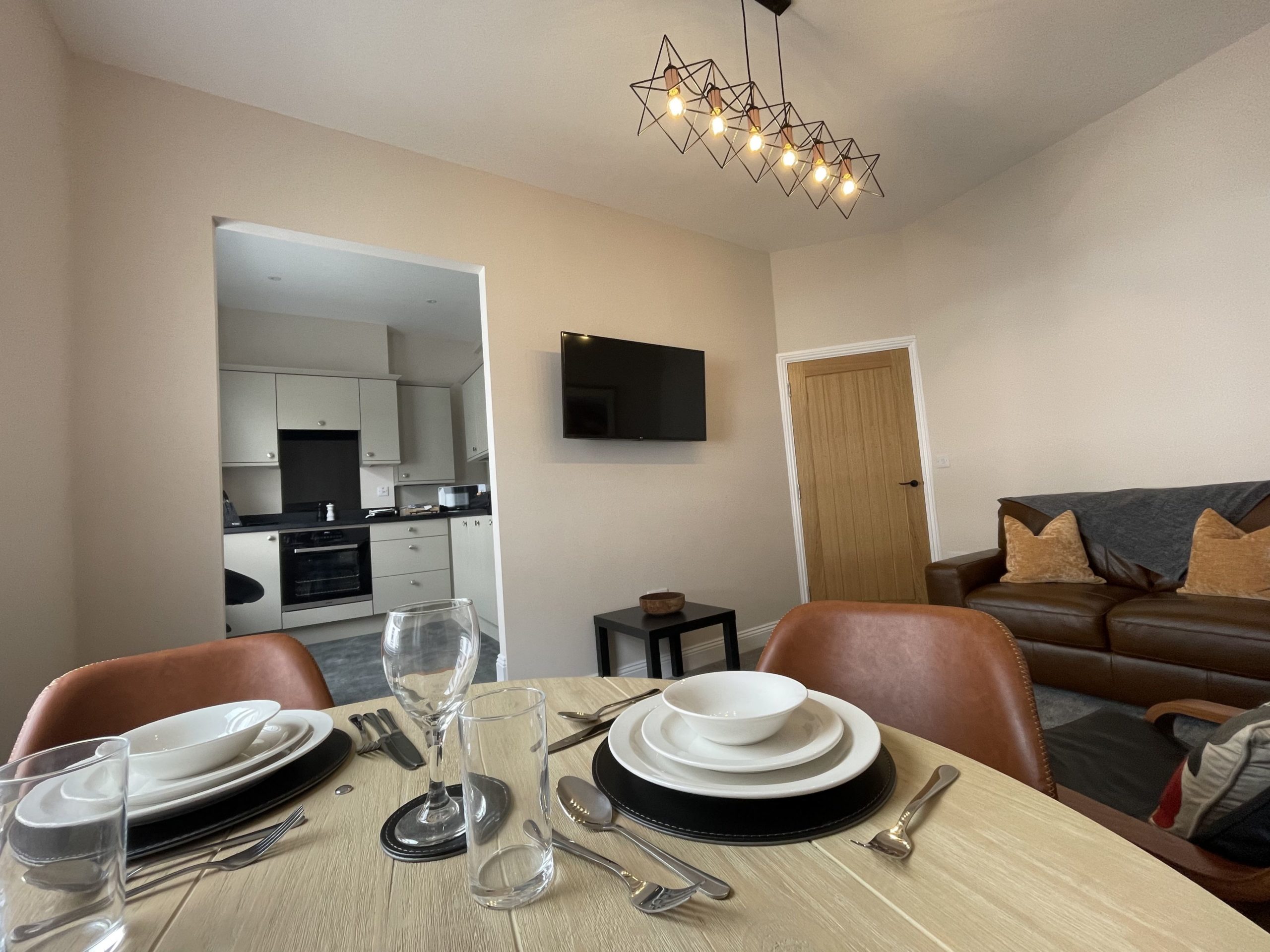 The dining table is positioned next to the window so you can enjoy the view whilst tucking in to a delicious meal.