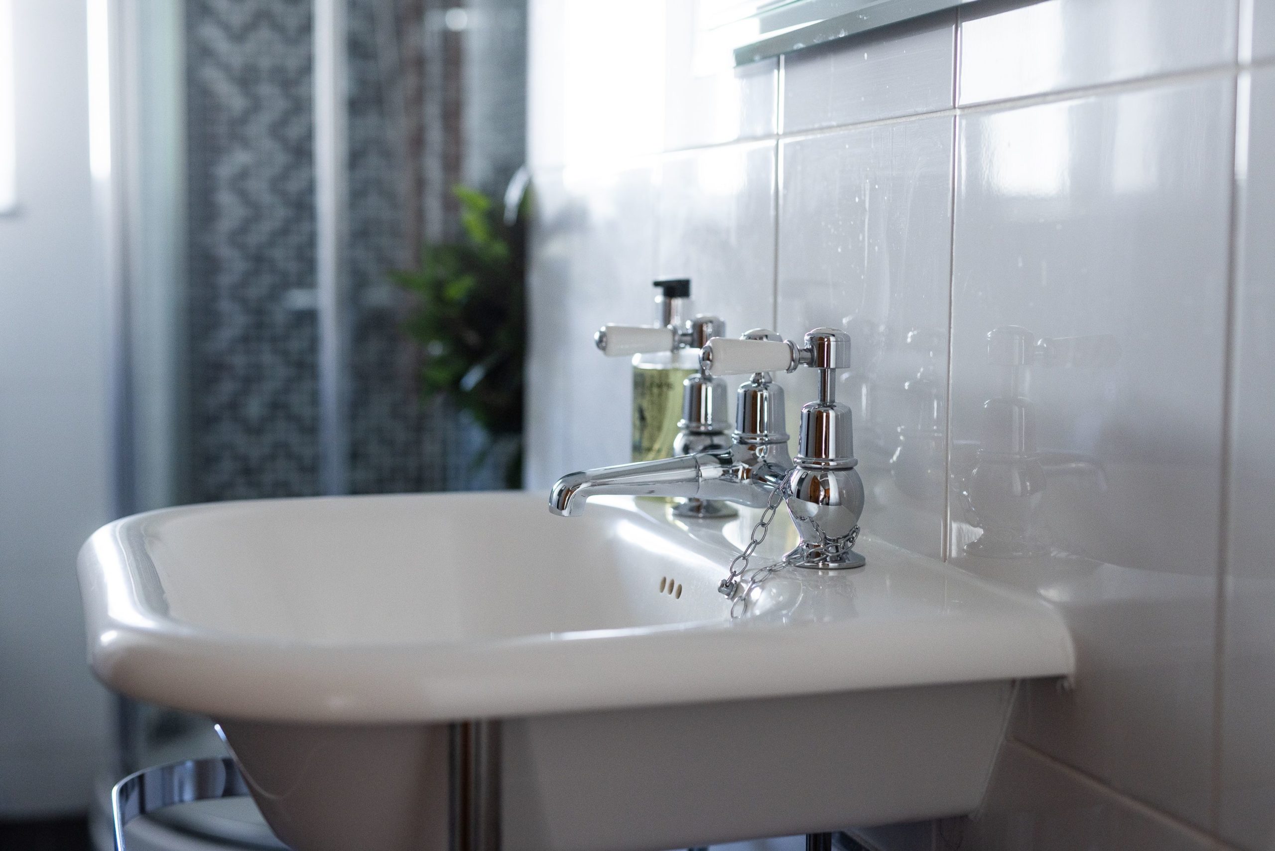 smart shower room with shower cubicle, basin and WC.