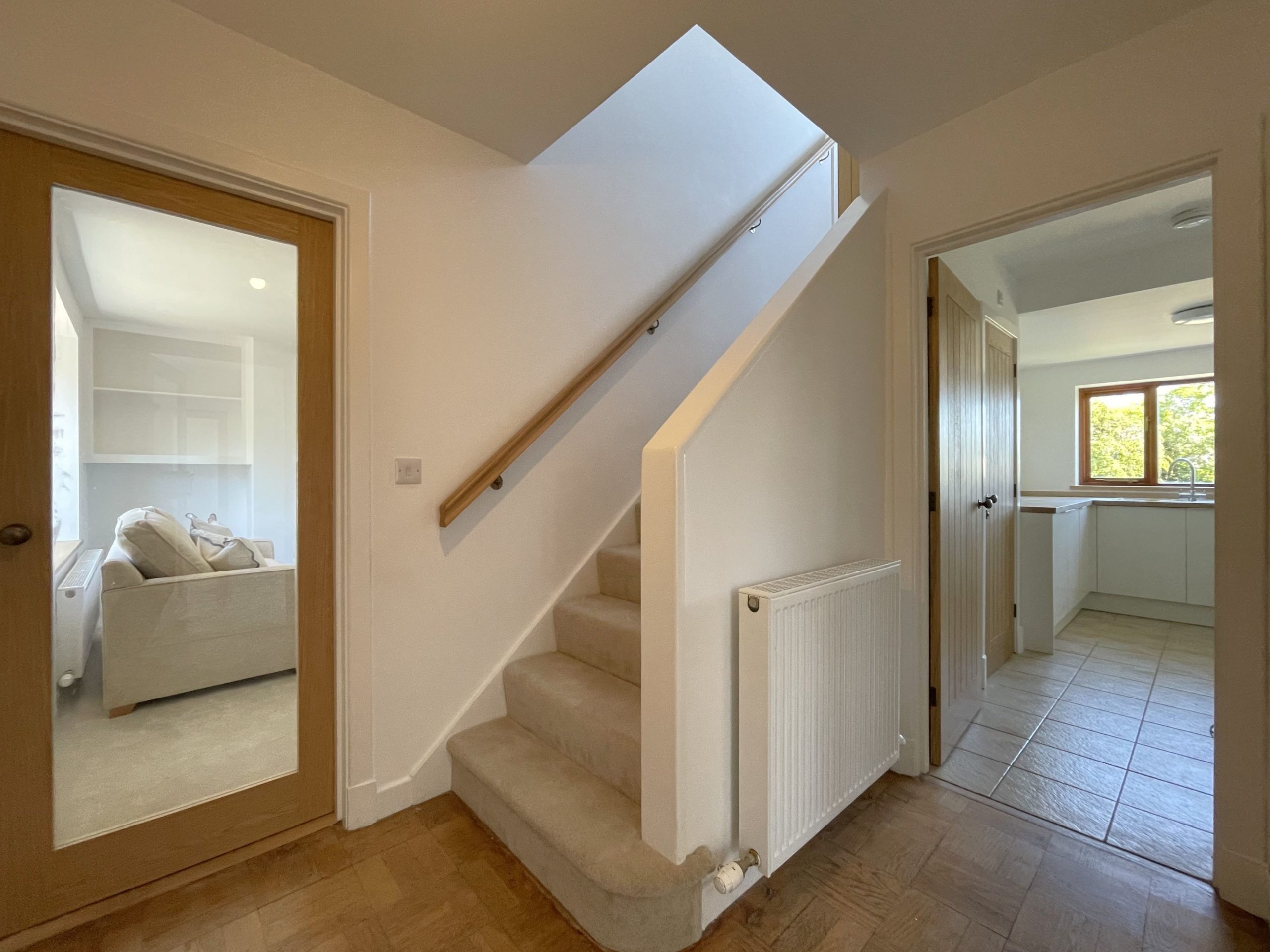 The hallway is bright and welcoming as you enter the property